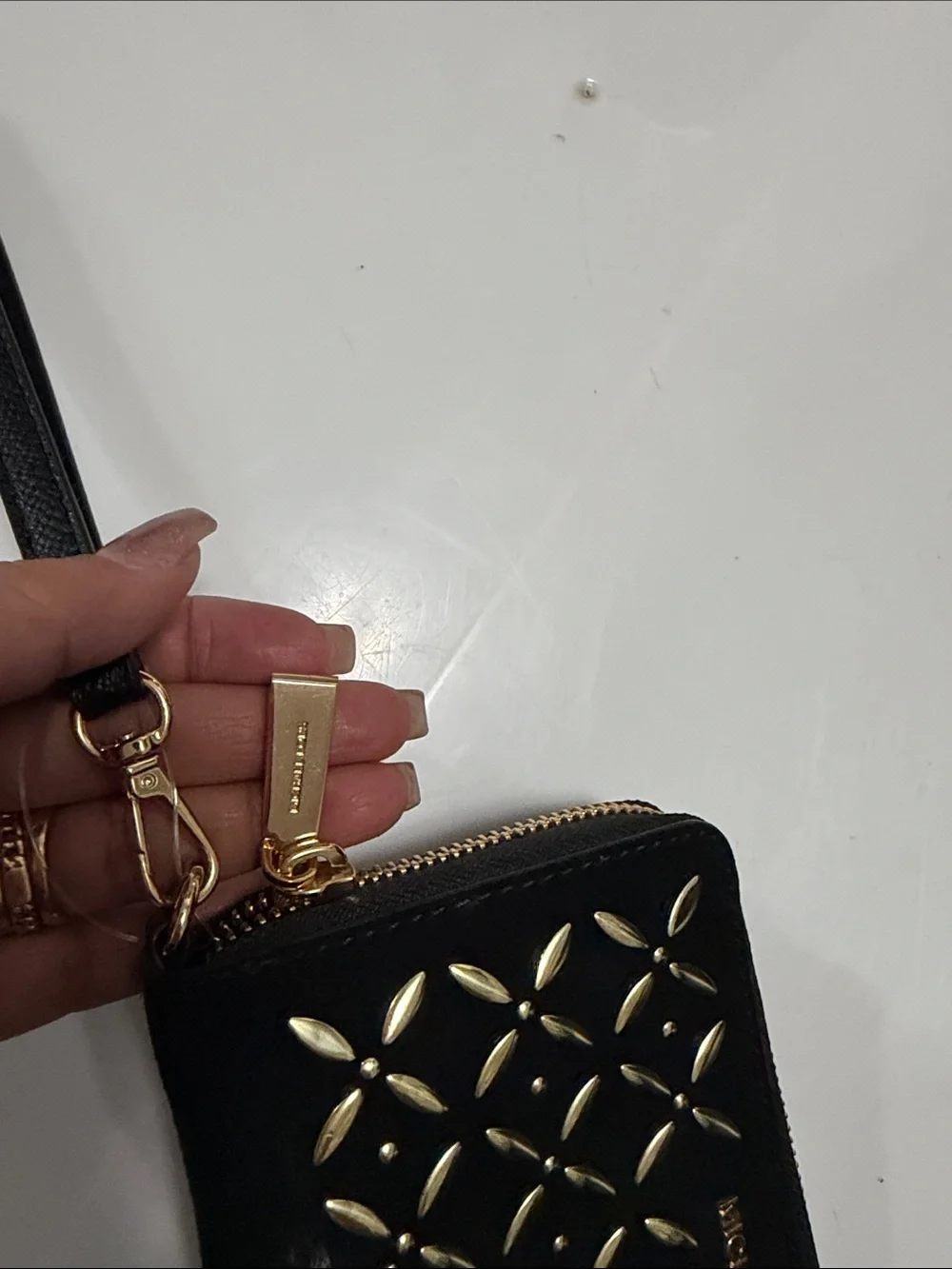 Michael Kors Black Wristlet with Gold Stud Pattern